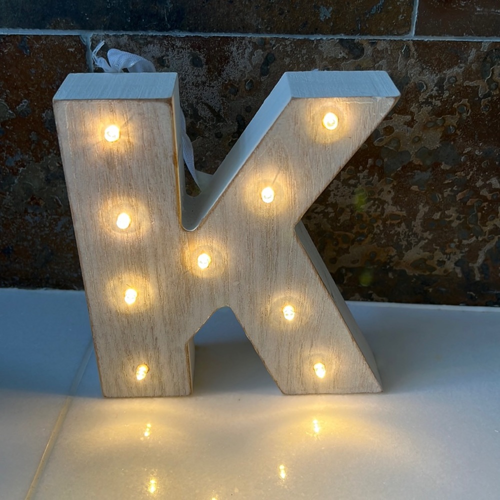 Wooden K ornamental accent. Lights up with 2 AA batteries.